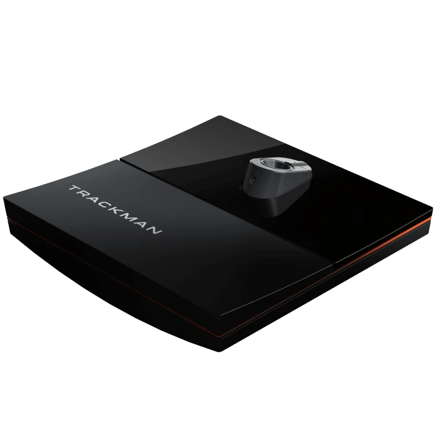 Black Trackman device with sleek design, featuring a central sensor and the brand name on its surface.