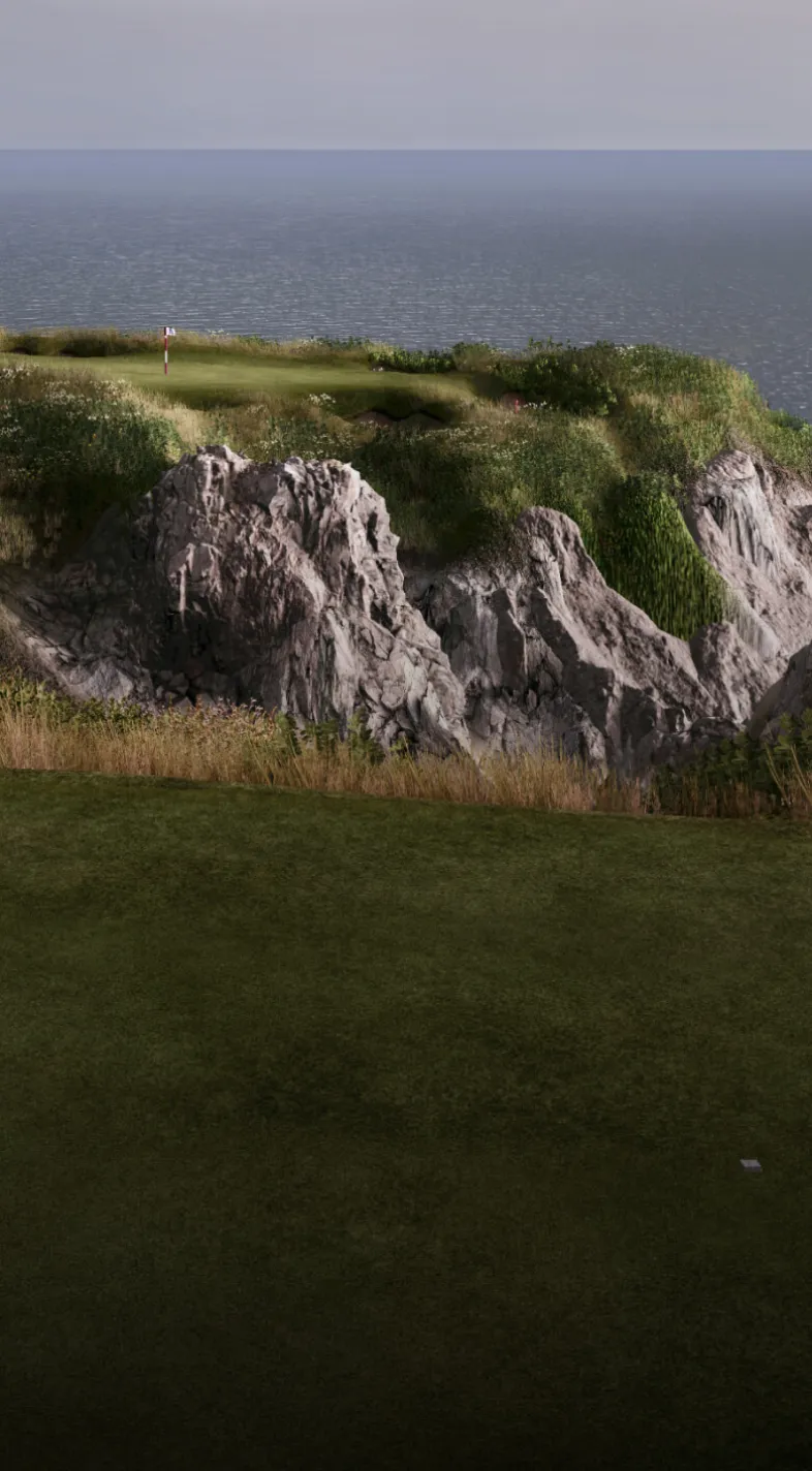 A coastal golf course with a green atop rocky cliffs, overlooking the ocean under a cloudy sky.